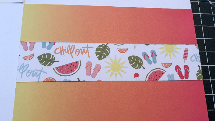 adding a strip of summer paper to the easy scrapbook page 