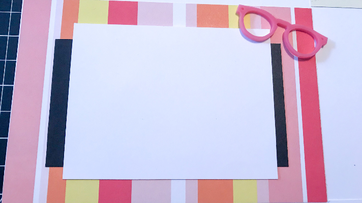 Adding acrylic shapes to the summer scrapbook page