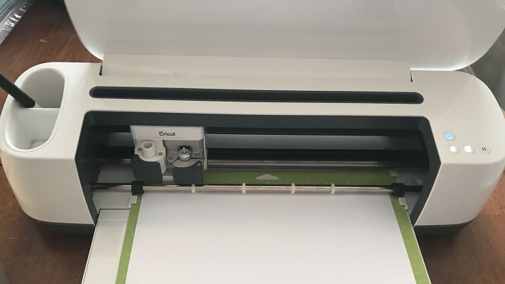 Cricut Maker creating a scrapbook page