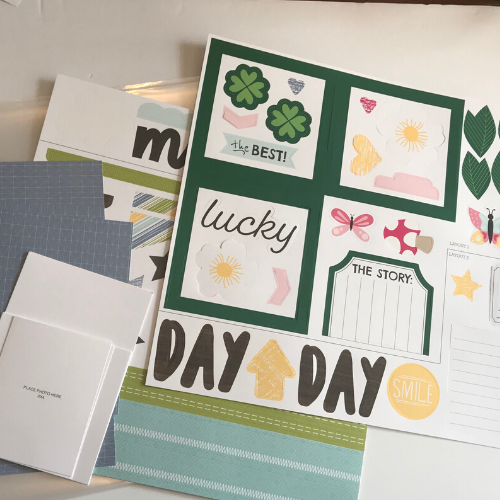 the scrapbook kit comes with all the paper, stickers, and embellishments