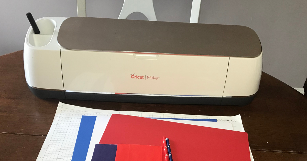 Supplies for 4th of July Cricut Craft idea with Cricut machine, card stock, and paper straws