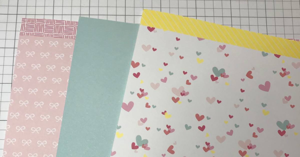 CTMH Scrapbook paper is the third step in creating a perfect page