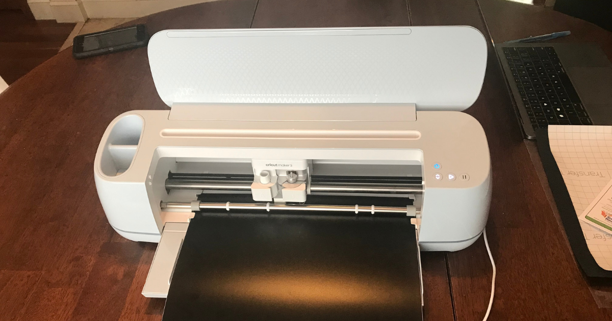 Cricut Maker 3 cutting the vinyl for the easy scrapbook album cover